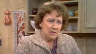 Edith Bunker (Jean Stapleton) receives distressing news on All in the Family