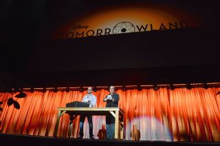 "Tomorrowland" producer Damon Lindelof (left) and director Brad Bird show off the contents of the "dusty old box" for attendees at Disney's D23 Expo in Anaheim, Calif., Saturday, Aug. 10, 2013.