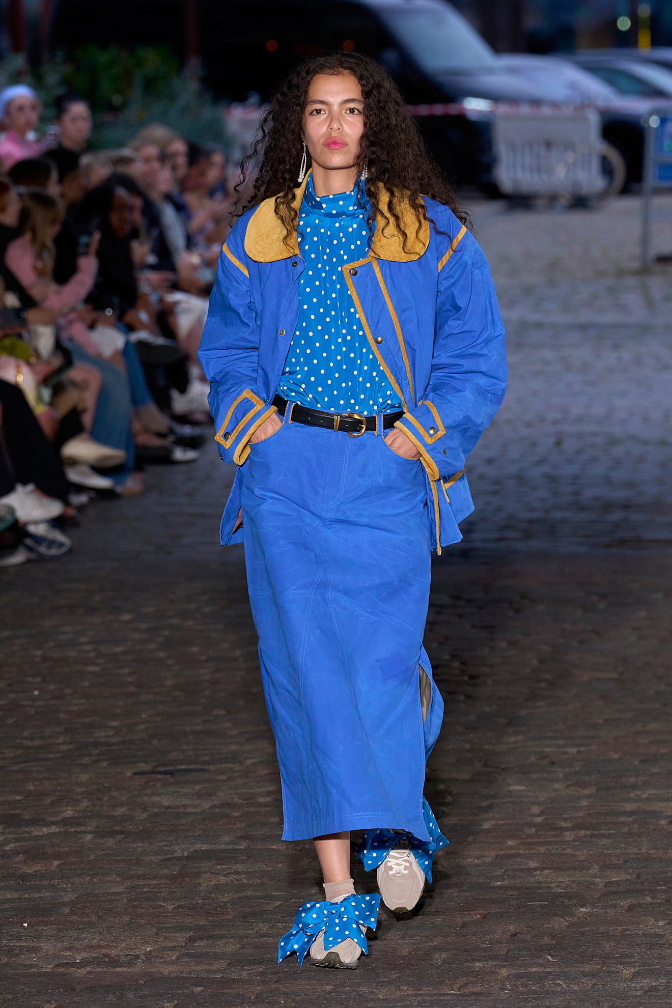 Woman wearing cobalt blue dress during Copenhagen Fashion Week.