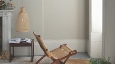 Drop Cloth painted living room with rattan lounge chair in the middle