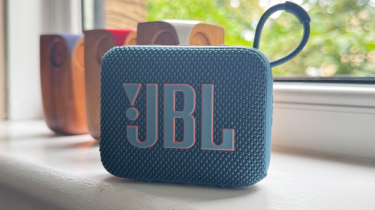 The JBL Go 4 portable Bluetooth speaker on a white windowsill