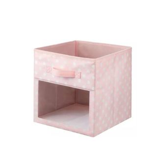 A pink and white spotted storage cube