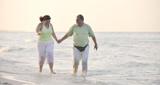 Overweight couple on beach