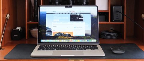 Apple MacBook Air sitting on a wooden desk