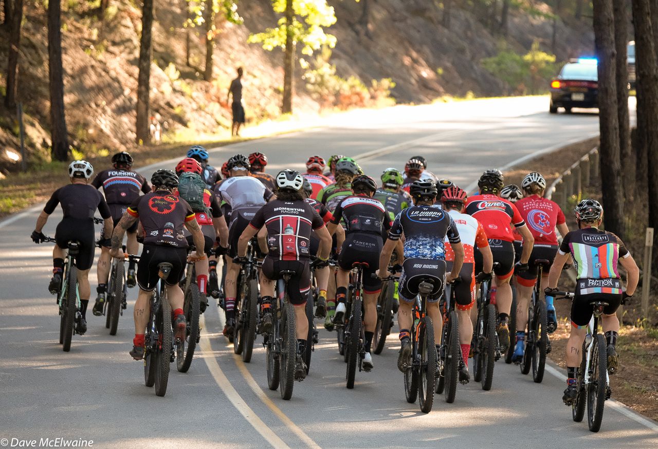 The Pro Men head up the first significant climb on the starting loop.