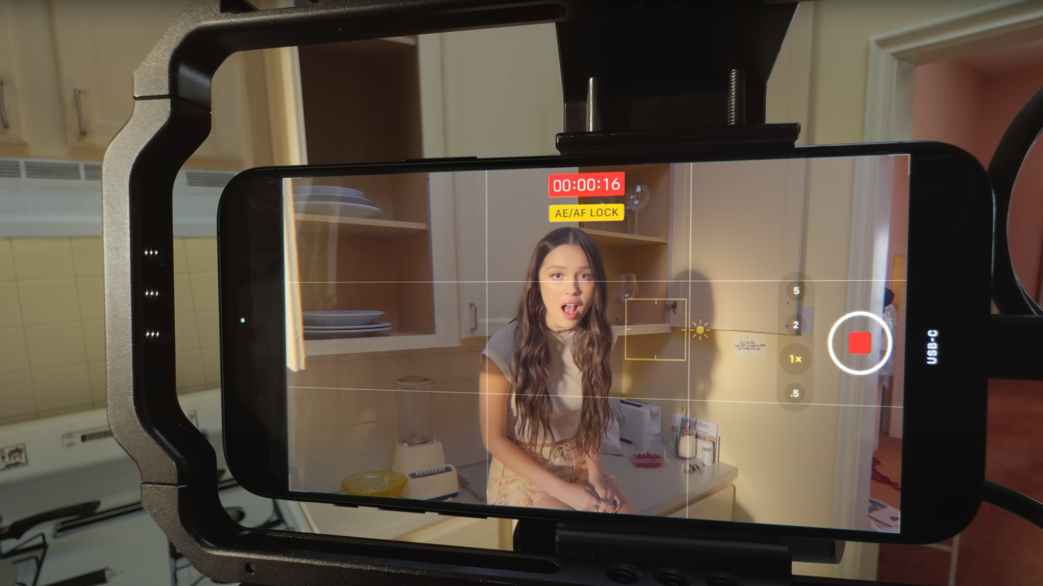 The iPhone 15 Pro being used in an Olivia Rodrigo music video