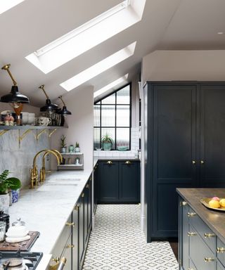 modern kitchen with blue-black cabinets, marble countertops, skylights and white floor tiles