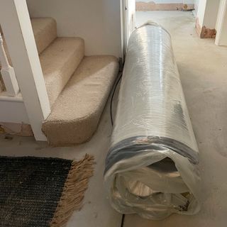 Mattress rolled and wrapped in plastic for delivery