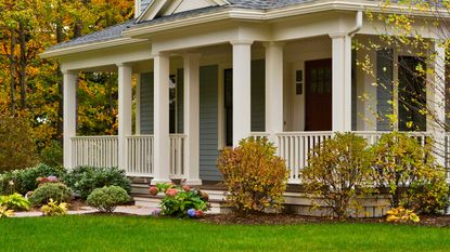 midwestern house with fall leaves on trees