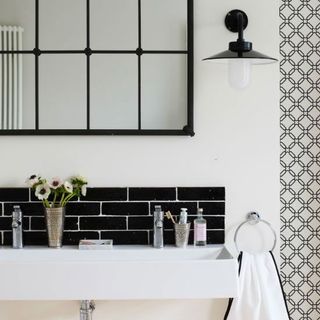 bathroom with white wall and hanging napkin