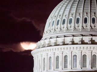 The super moon (the full moon that is closest to Earth each year) sneaks behind the U.S. Capitol's rotunda dome on Cinco de Mayo.