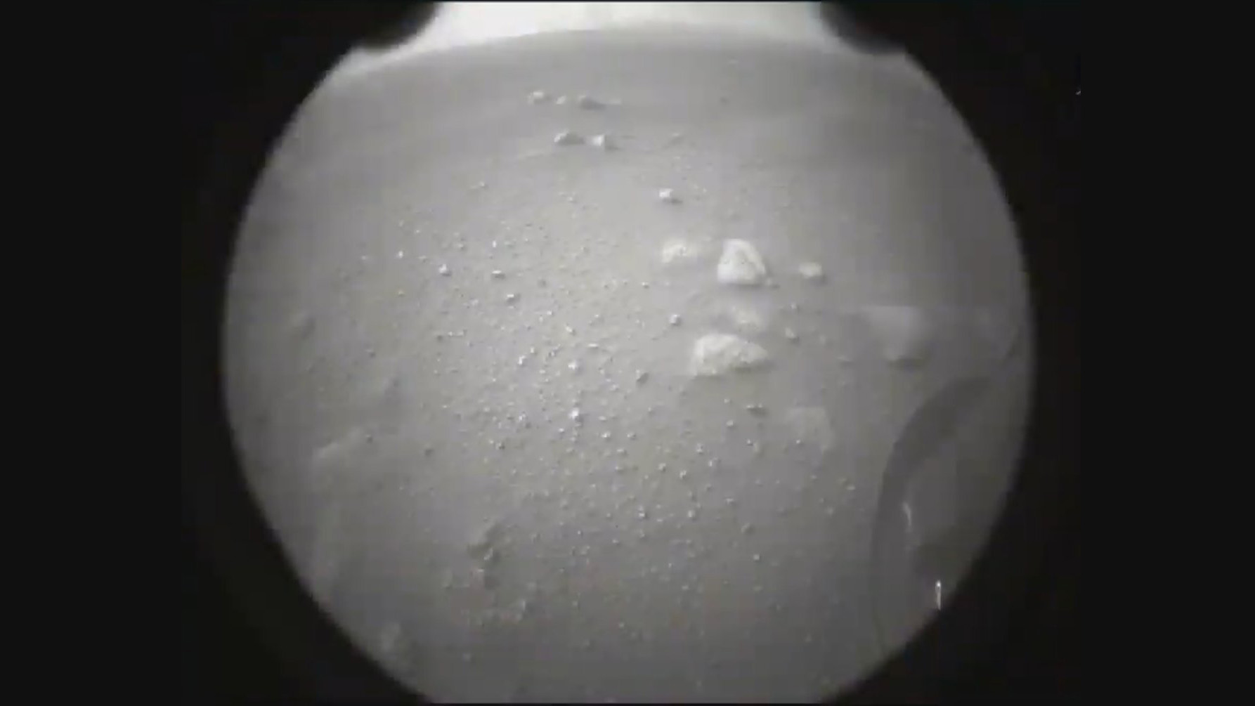 A second image from the Perseverance rover taken just after landing shows the view from the rear of the spacecraft.