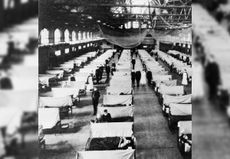 Flu patients are treated at Iowa State University in a gymnasium converted into a hospital during the influenza epidemic of 1918.