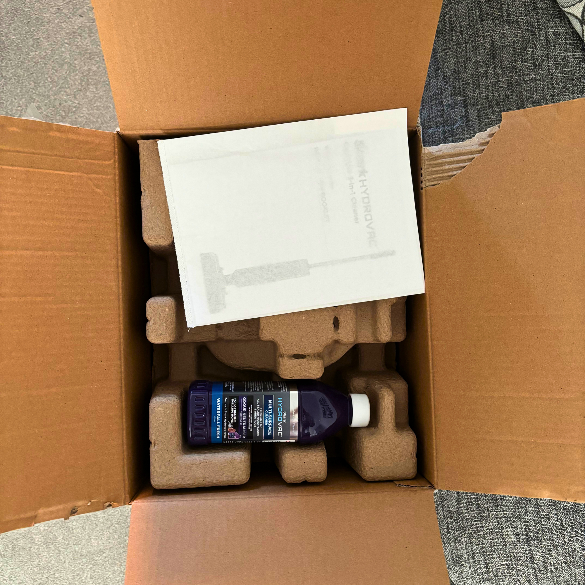 aerial view of inside of Shark HydroVac Cordless Hard Floor Cleaner packaging 