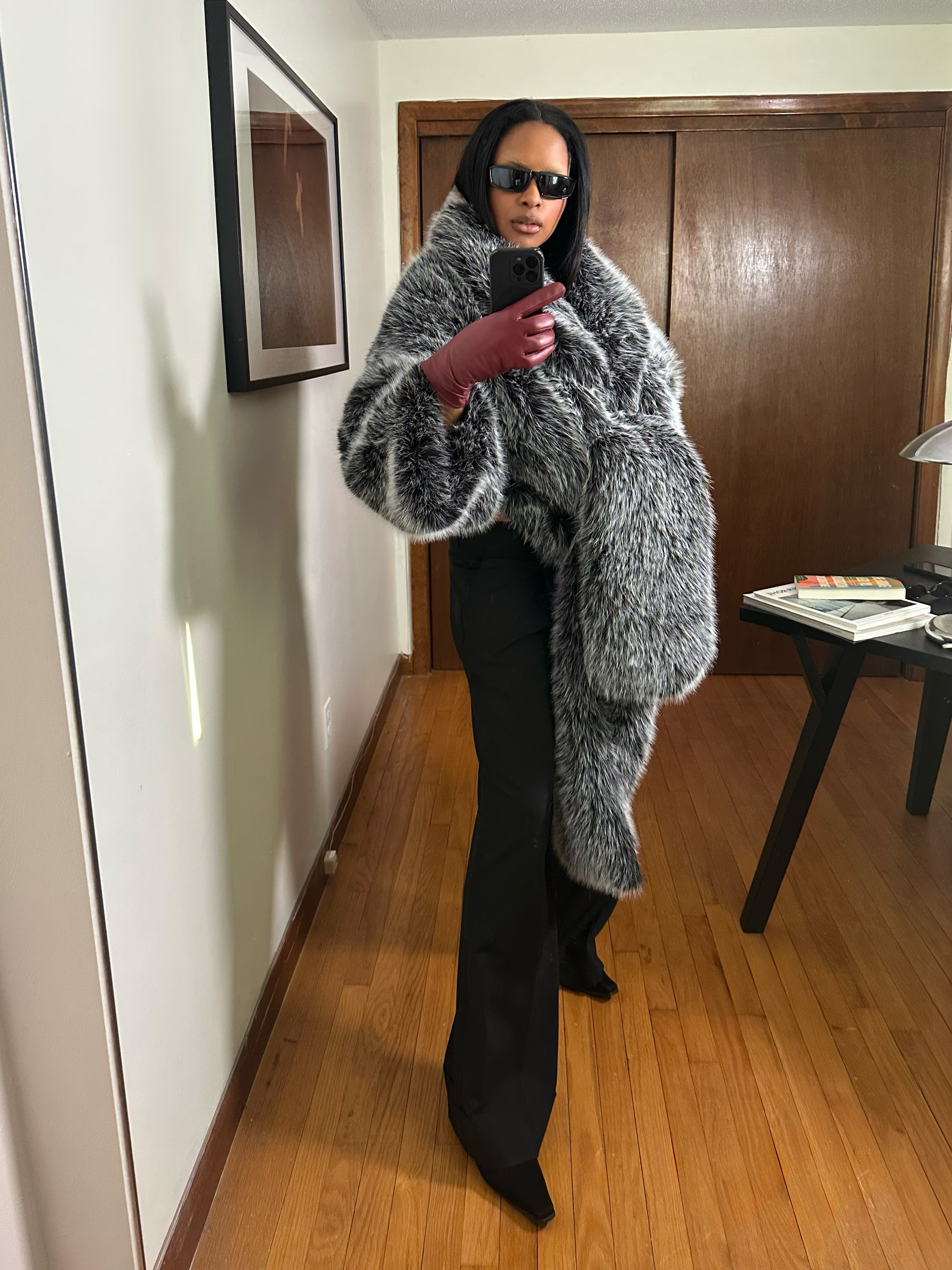 Maya Moore wearing red leather gloves and an all-black outfit