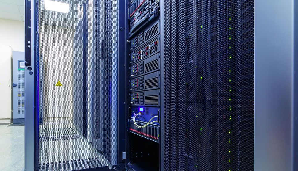 A server rack with its security door unlocked in a data center.