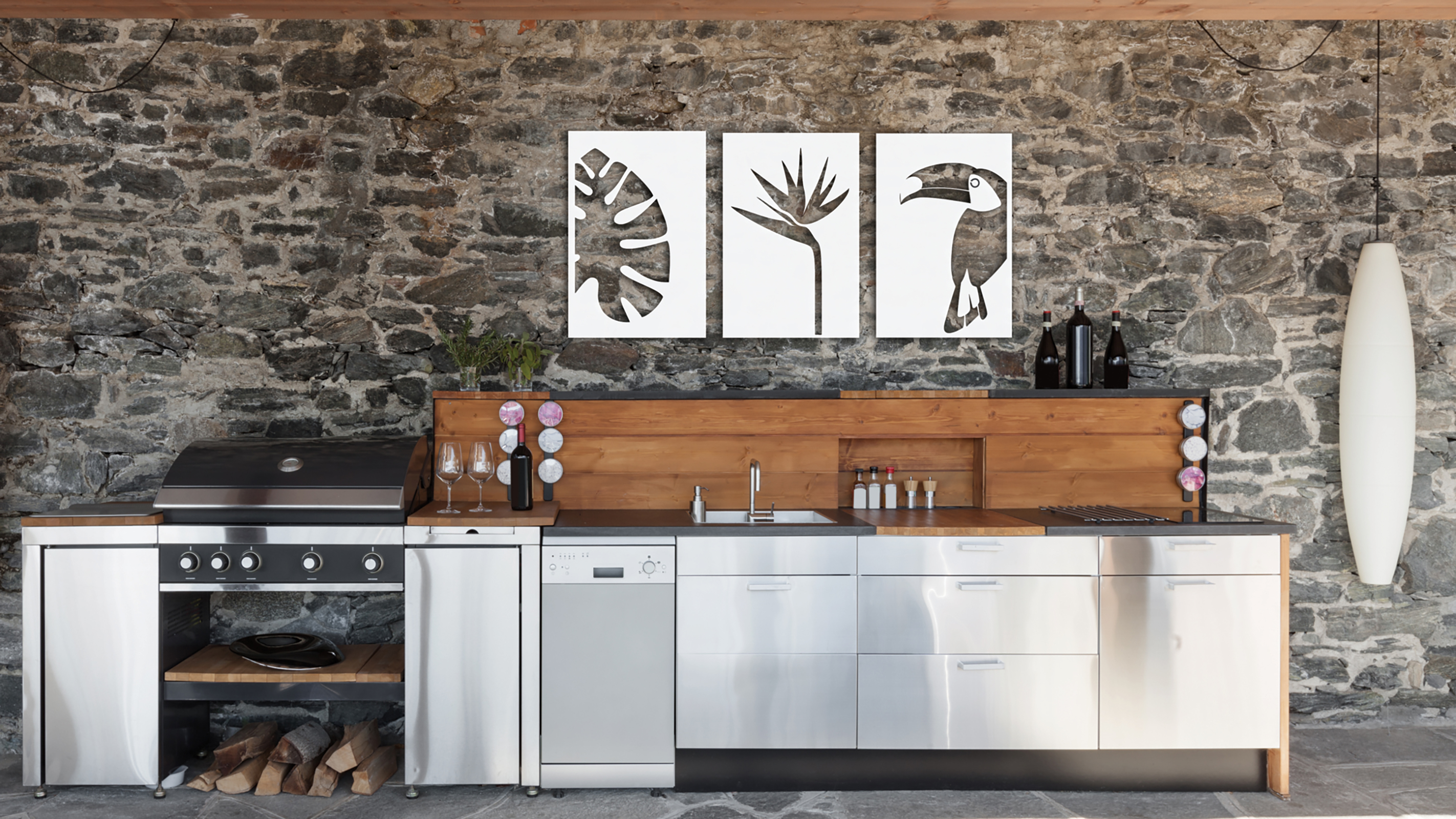 stainless steel outdoor kitchen with wall art