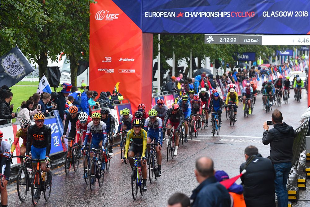 The peloton heads through the finish area