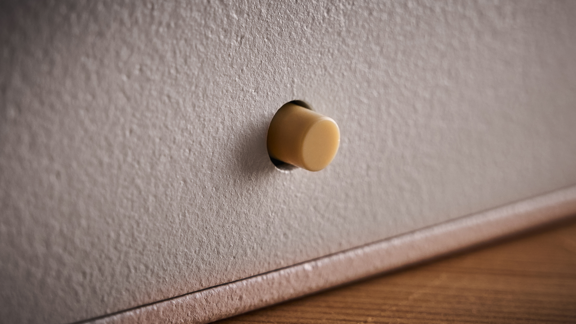 The sym/asym button on the Attic Audio Putty Saturation Preamp pedal