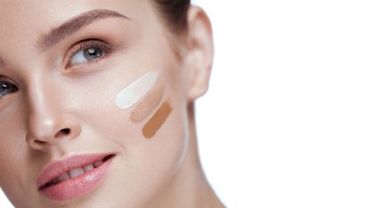 Girl With Foundation Cream On Beauty Face - stock photo