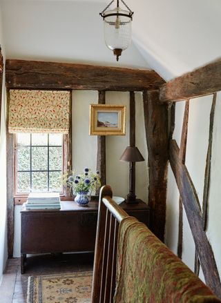 The landing of a period property with exposed timber frame