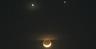 Venus (left) and Jupiter (right) at a conjunction in the night sky.