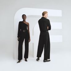 Man and woman wearing outfits from Farfetch