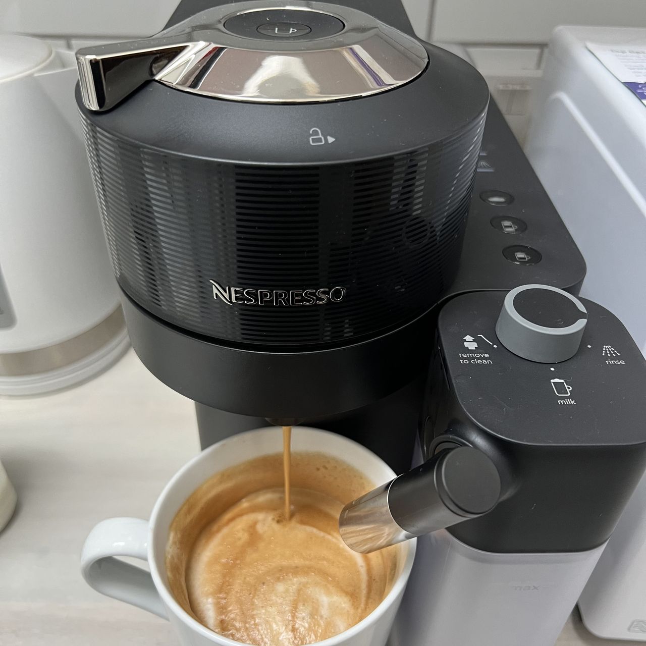 Using the Nespresso Vertuo Lattissima machine to create a frothy coffee