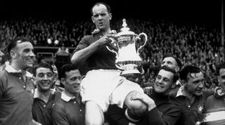 24th April 1948: Manchester United captain Johnny Carey is carried shoulder high after his team beat Blackpool 4-2 in the FA Cup final at Wembley Stadium, London. (Photo by William Vanderson/Fox Photos/Getty Images)