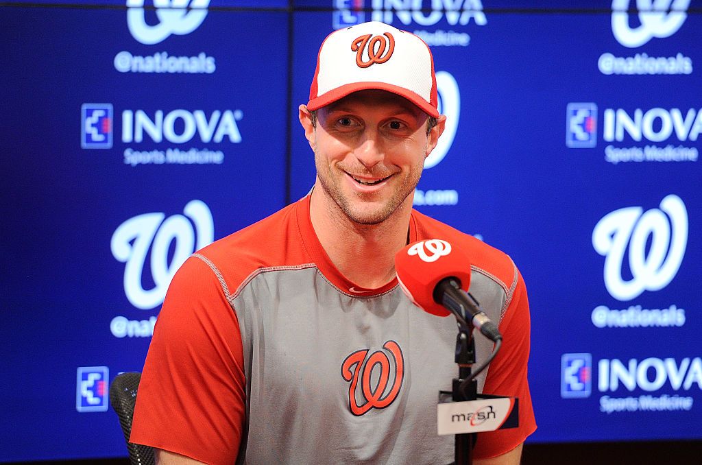 Max Scherzer plays catch with a young Mets fan. 