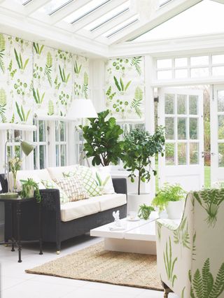 White garden room conservatory interior with green blinds