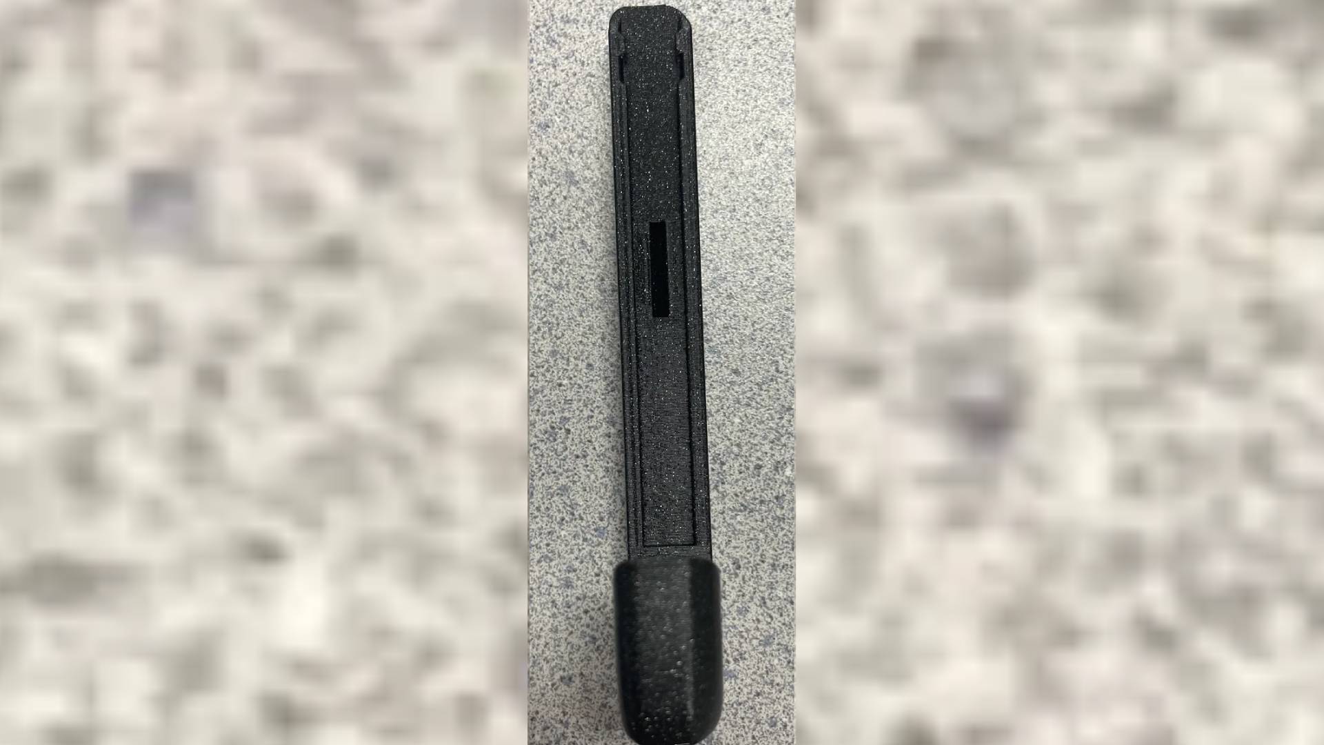 3D Printed Switch 2 to Joy-Con adapter with rail side facing forward.