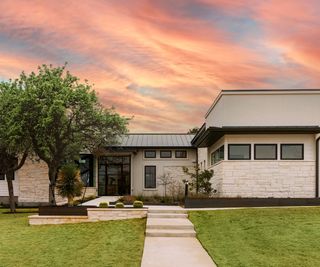 exterior of contemporary house with sunset and tree