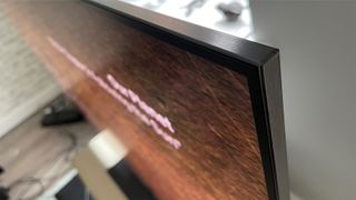 Samsung QE65S95D QD-OLED TV from top/side showing bezel
