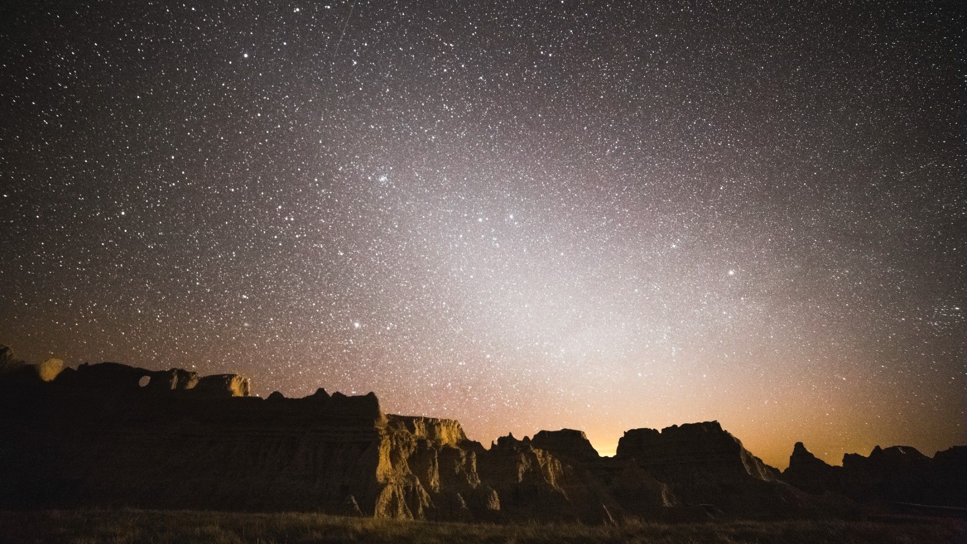 Zodiacal light rises over the Badlands of South Dakota.