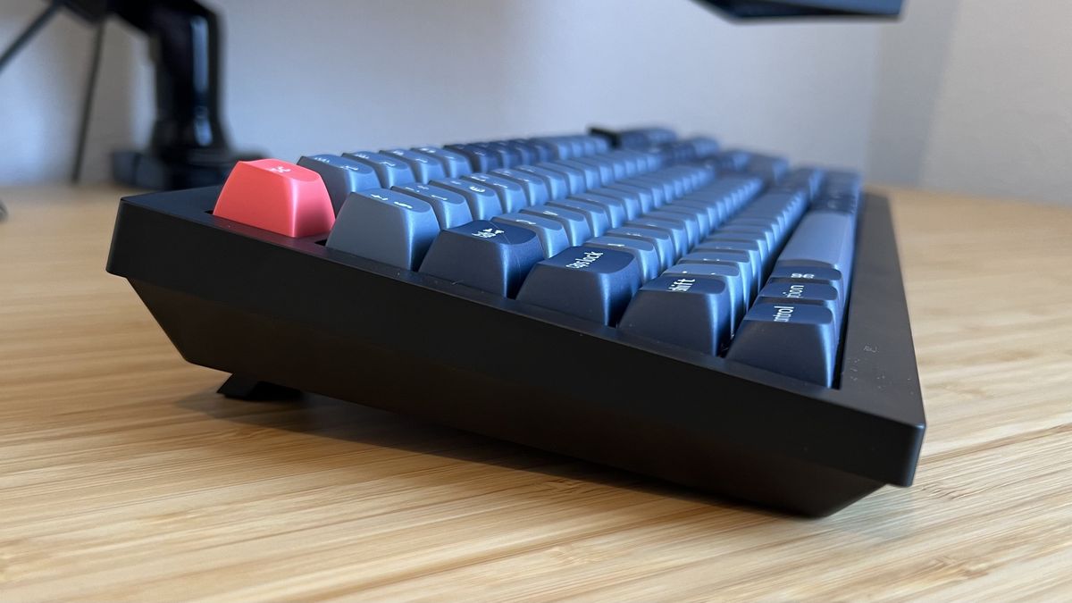 Side view of Keychron V6 Max keyboard on a wooden desk