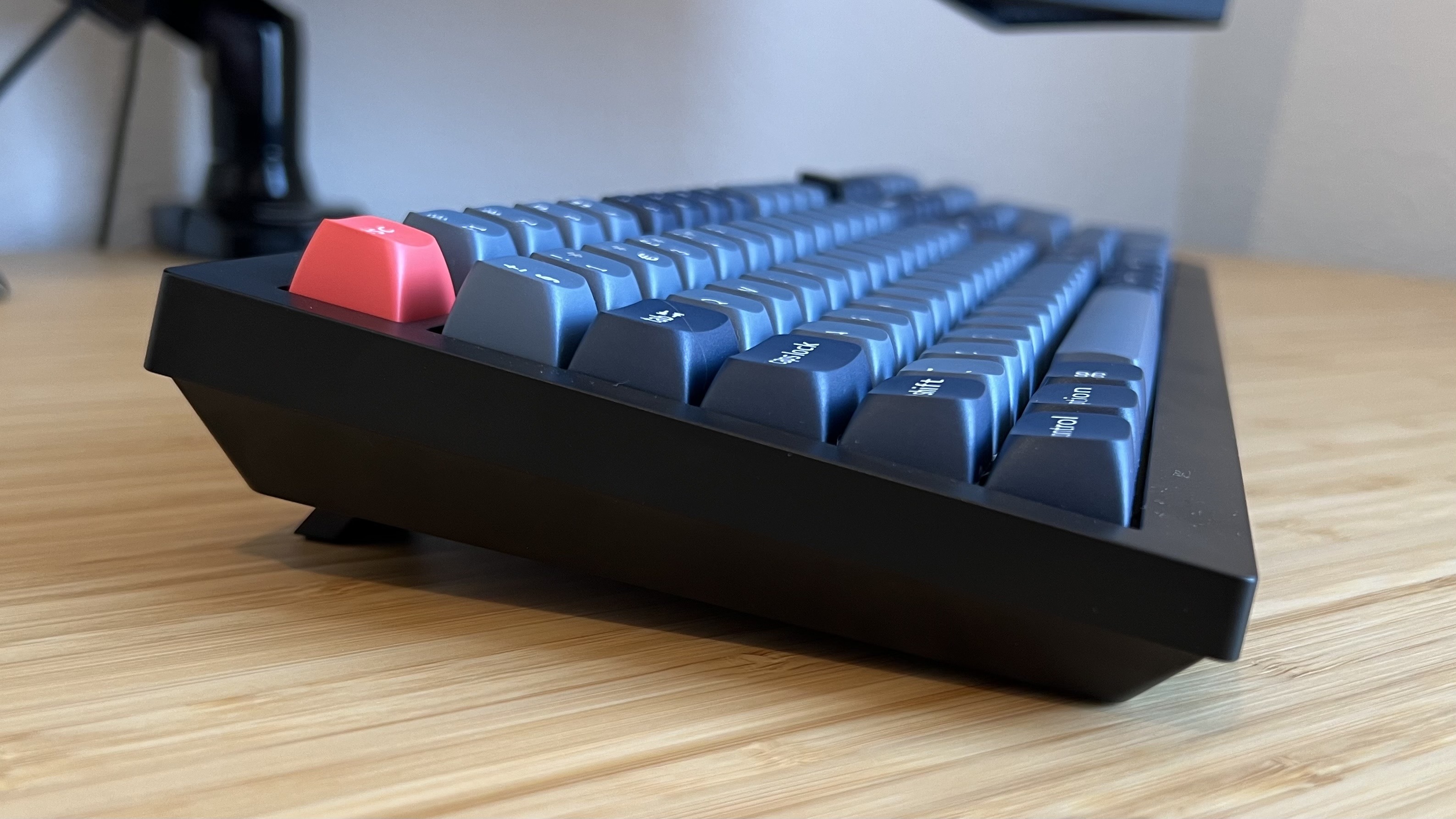 Side view of Keychron V6 Max keyboard on a wooden desk