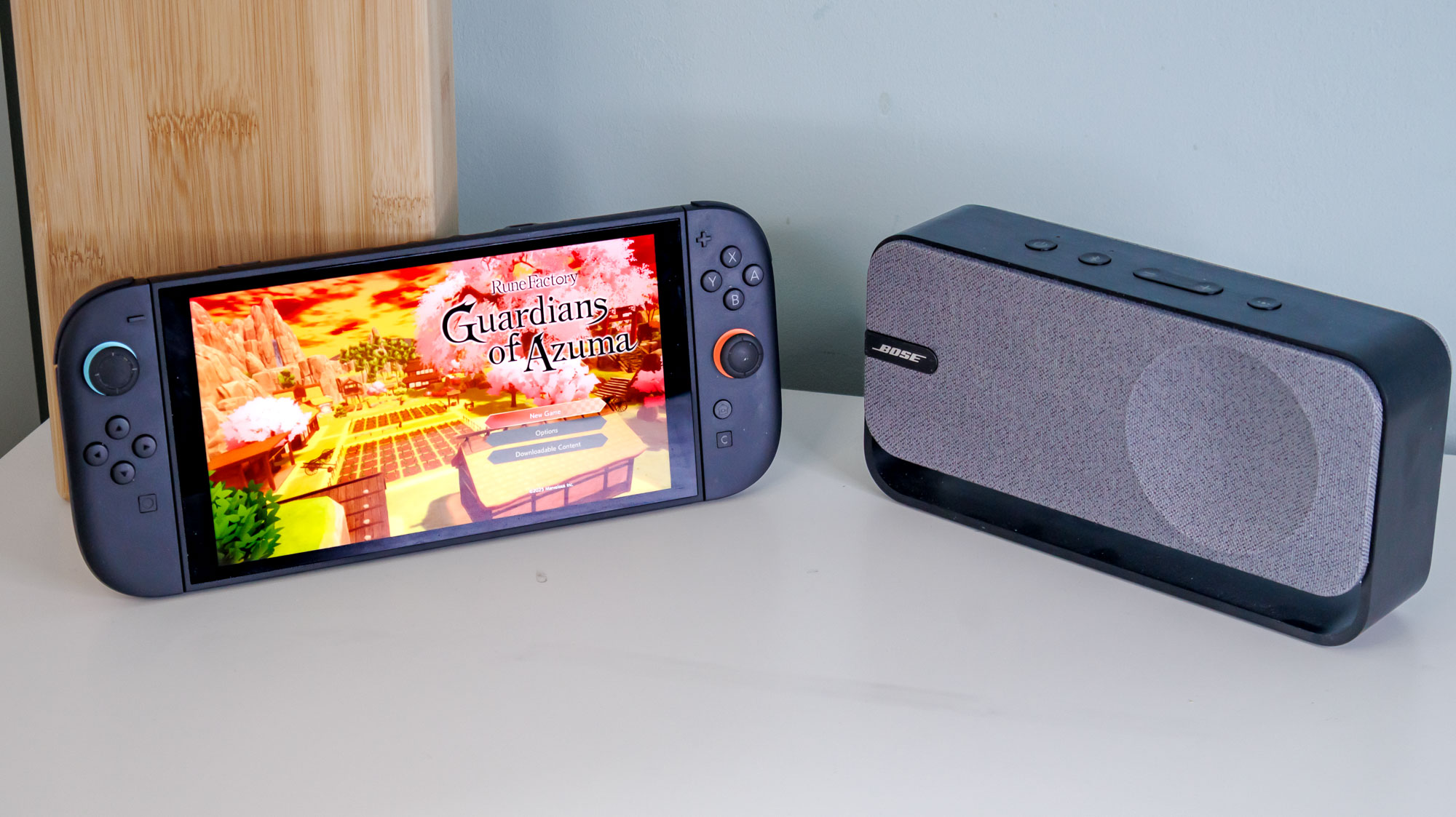 Nintendo Switch 2 next to a Bose SoundLink Home Bluetooth speaker