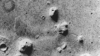 The 1976 'Face on Mars' image from the Viking Orbiter.