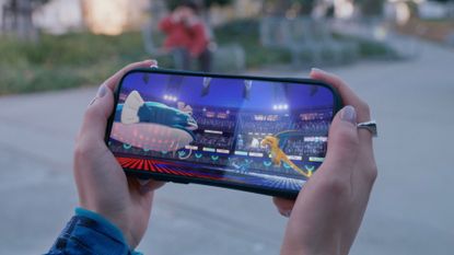 Pok&eacute;mon Champions running on a phone