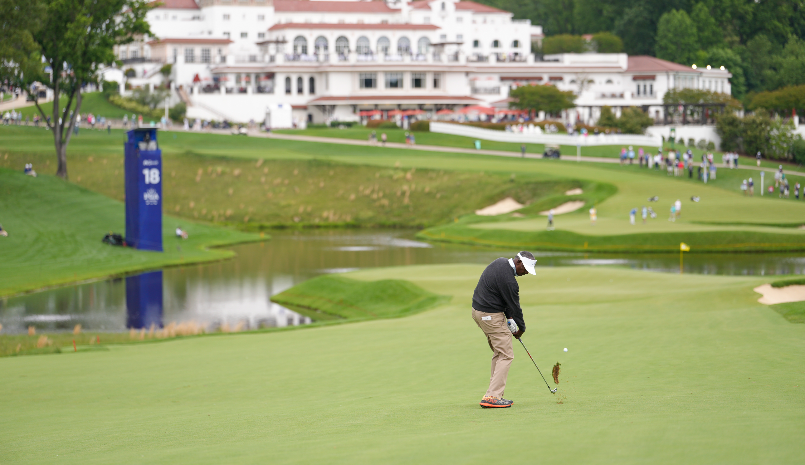 Vijay Singh hits an approach into the green at the Senior PGA Championship