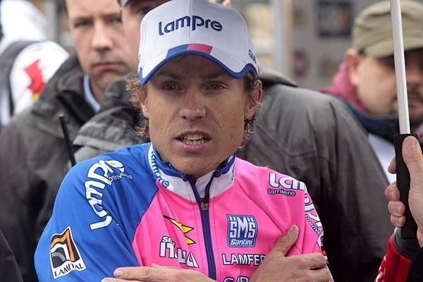 Cunego was shivering while waiting for the podium ceremony, after being soaked through to the skin.