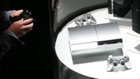 a silver Sony PlayStation 3 being photographed