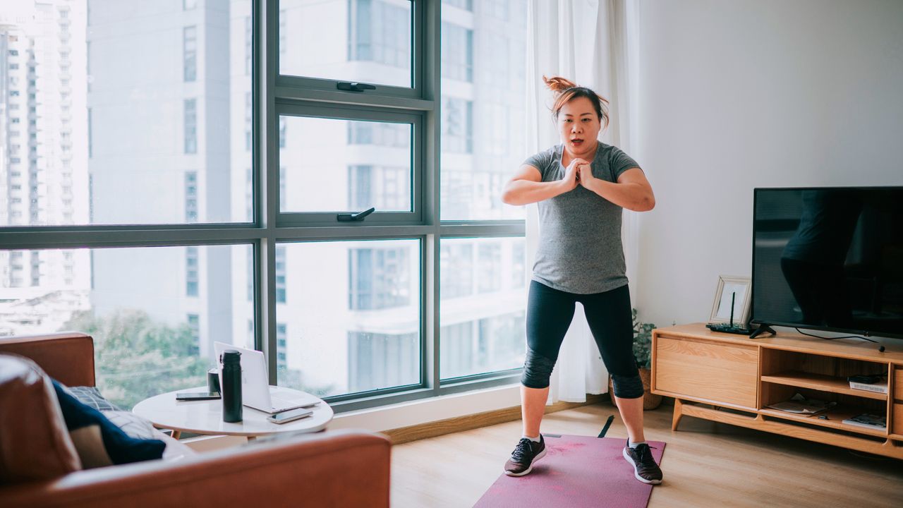 Woman exercising in domestic setting