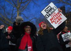 Nurses holding protest signs in New York