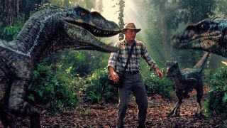 Screenshot from Jurassic Park III (2001).Three raptors surround Dr. Grant.