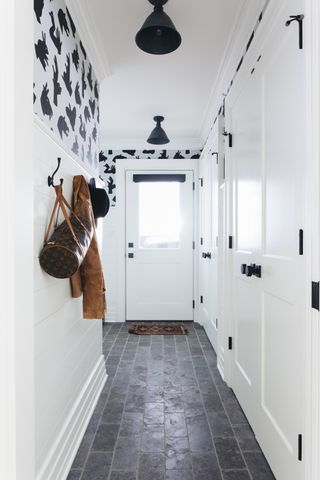 black and white hallway with built in storage closet