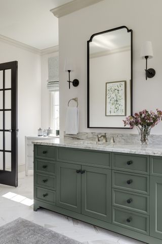 white bathroom with sage vanity