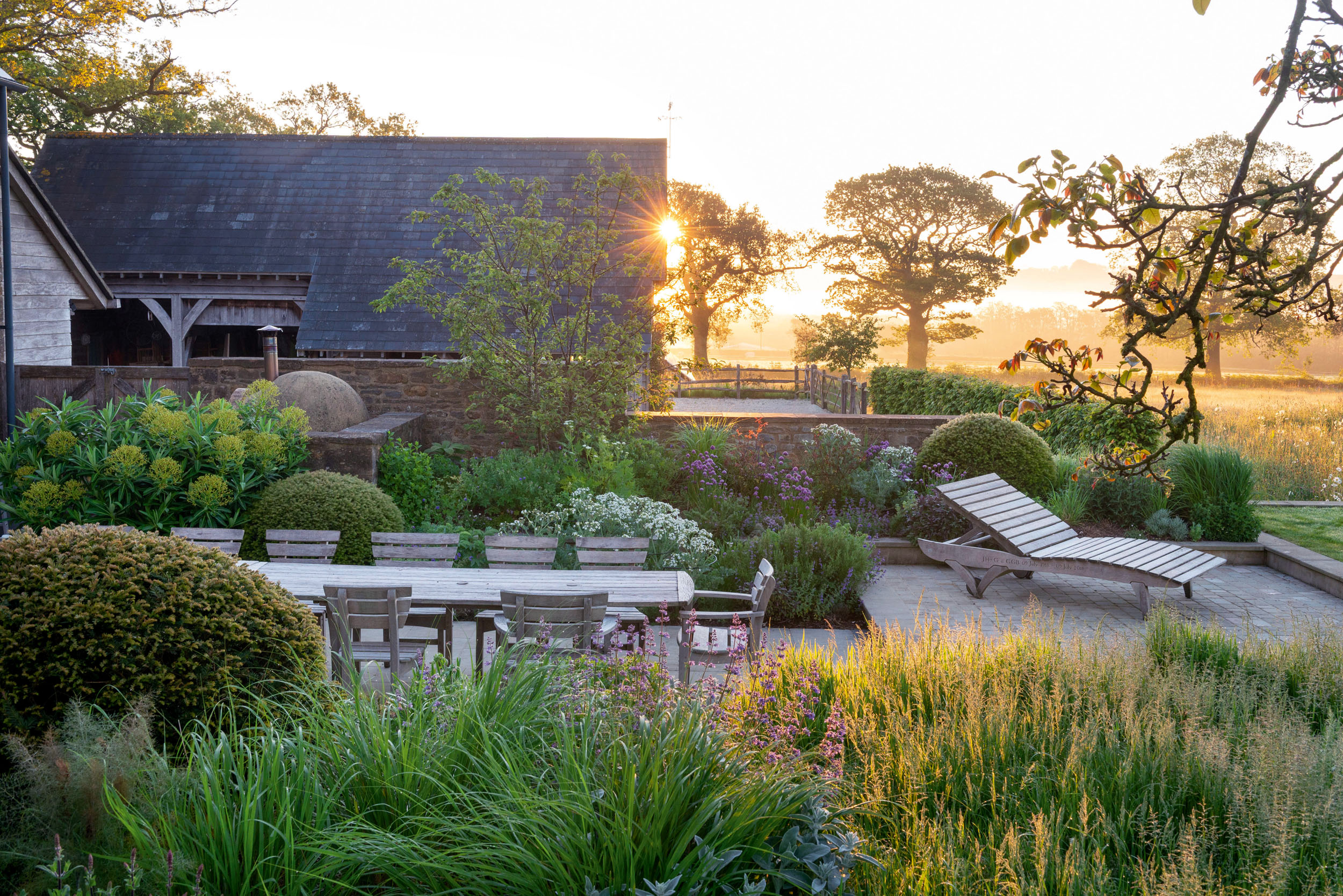Furniture by Hampshire-based Gaze Burvill in a garden designed by Harris Bugg, which has studios in Devon, London and Scotland  &mdash; The Experts' Experts in Country Life