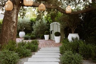 A backyard entrance decorated with string lights
